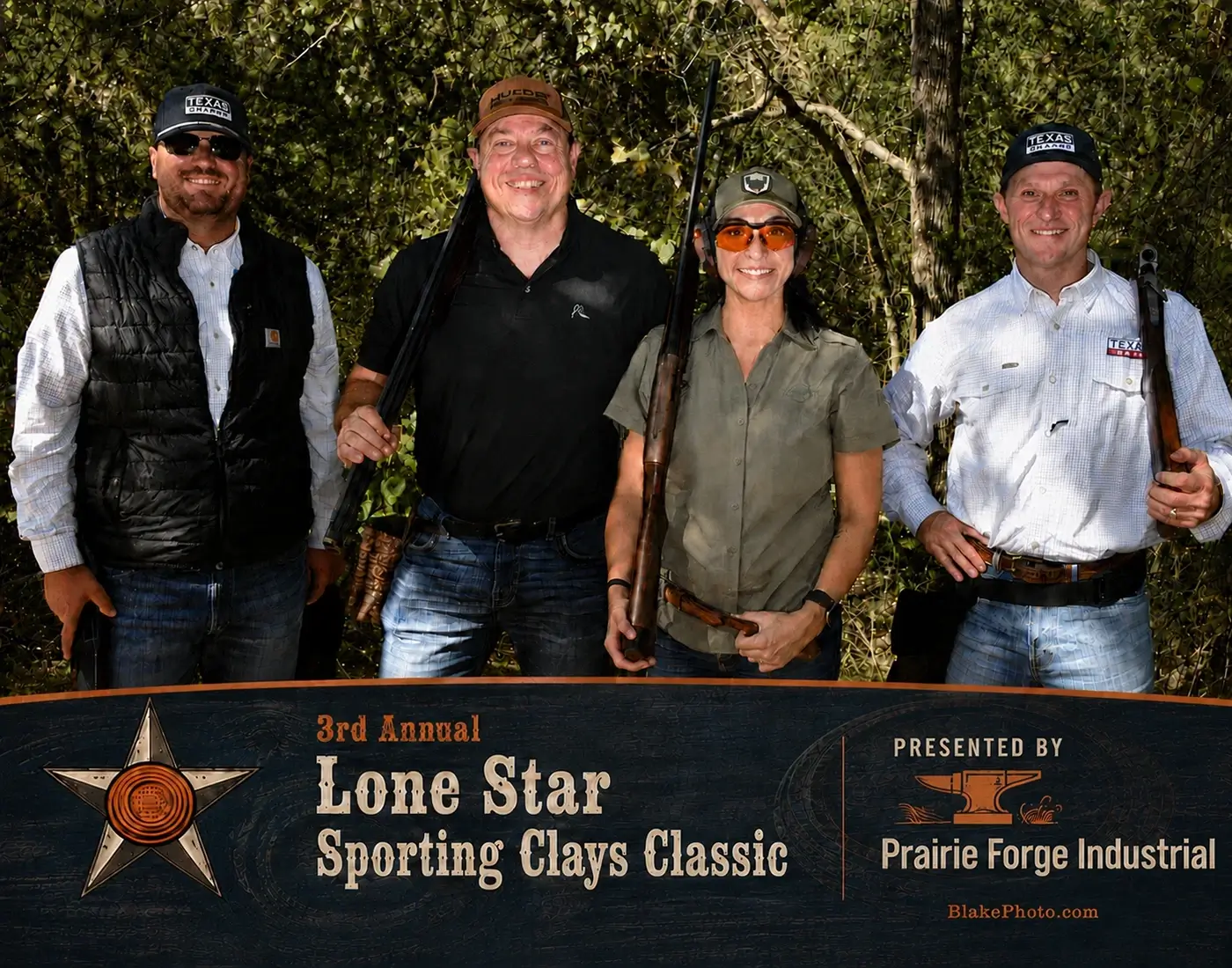 Clay shoot participants posing with shotguns for their finished team photograph.