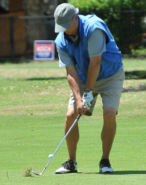 Golfer hitting shot from fairway at Dallas-Ft. Worth golf tournament
