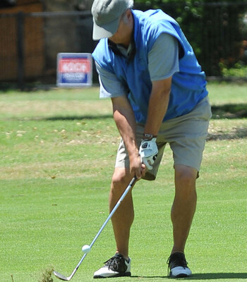 Golfer hitting shot from fairway at Dallas-Ft. Worth golf tournament