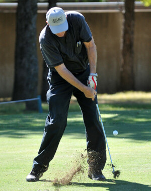 Golfer hitting shot from fairway at Dallas-Ft. Worth golf tournament
