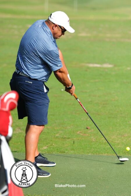 Golfer warming up on driving range at Dallas- Ft. Worth golf tournament