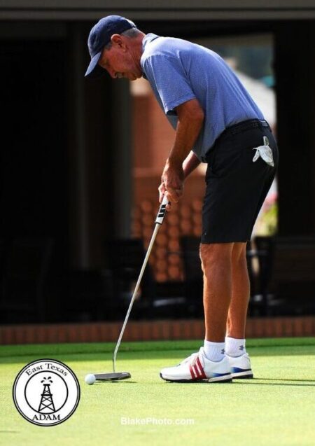 Golfer making the winning putt at Dallas Ft Worth golf tournament