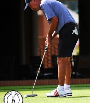 Golfer making the winning putt at Dallas Ft Worth golf tournament