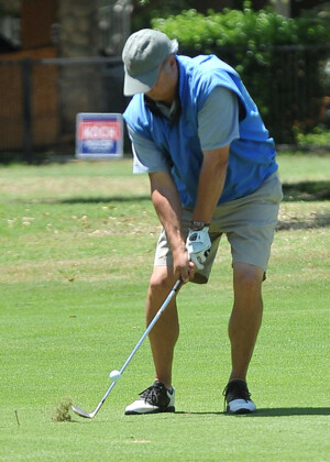 Golfer hitting shot from fairway at Dallas-Ft. Worth golf tournament