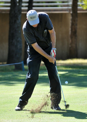 Golfer hitting shot from fairway at Dallas-Ft. Worth golf tournament