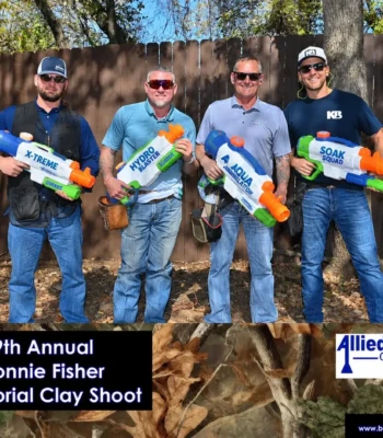 Four participants with water blasters at the 9th Annual Ronnie Fisher Memorial Clay Shoot, sponsored by Allied Drilling Company