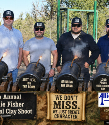 `Four clay shoot participants joking about their scores at the 9th Annual Ronnie Fisher Memorial Clay Shoot`
